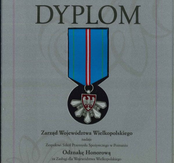 Na grafice przedstawiono odznakę Honorowa dla ZSPS.