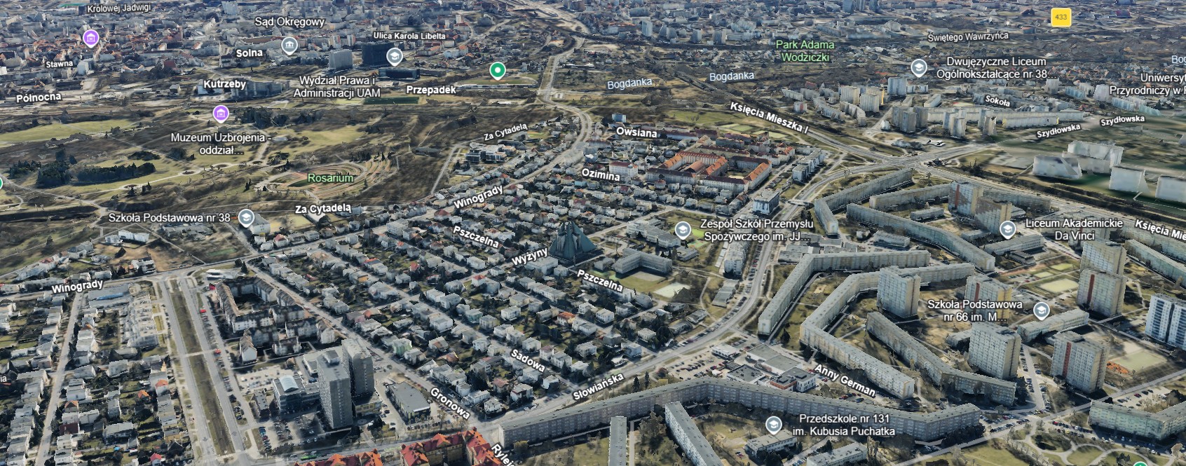 Na szarym tle, przedstawia mapę z konturami ulic i budynków na terenie objętym konsultacjami z mapy Google