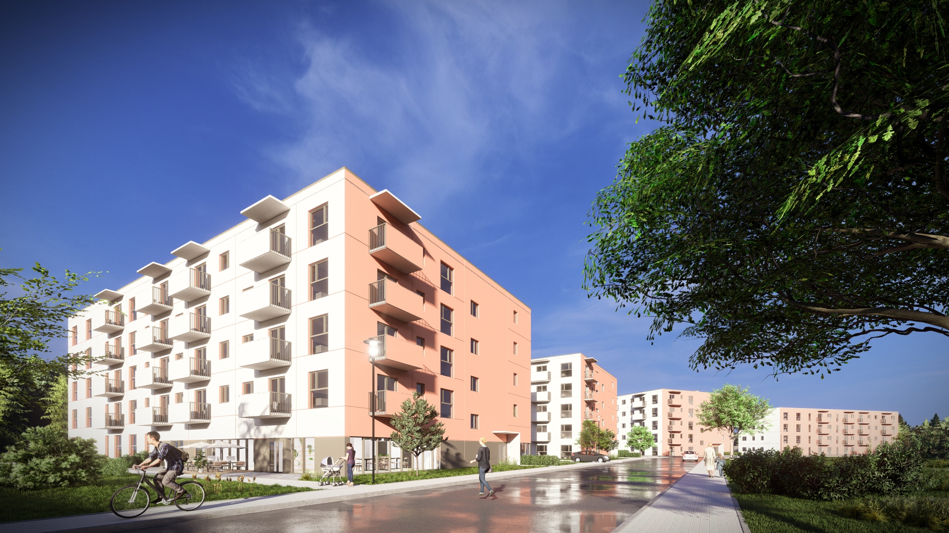 Wizualizacja nowoczesnego osiedla mieszkaniowego w słoneczny dzień. Na pierwszym planie po lewej stronie widać wielopiętrowy budynek o białej i jasnopomarańczowej elewacji z licznymi balkonami. Przed budynkiem przebiega asfaltowa ulica, po której porusza się rowerzysta oraz piesi, w tym osoba z wózkiem dziecięcym. Wzdłuż ulicy ciągną się kolejne, podobne bloki mieszkalne. Po prawej stronie widoczne są duże, zielone drzewa, a nad całością dominuje błękitne niebo z delikatnymi chmurami.