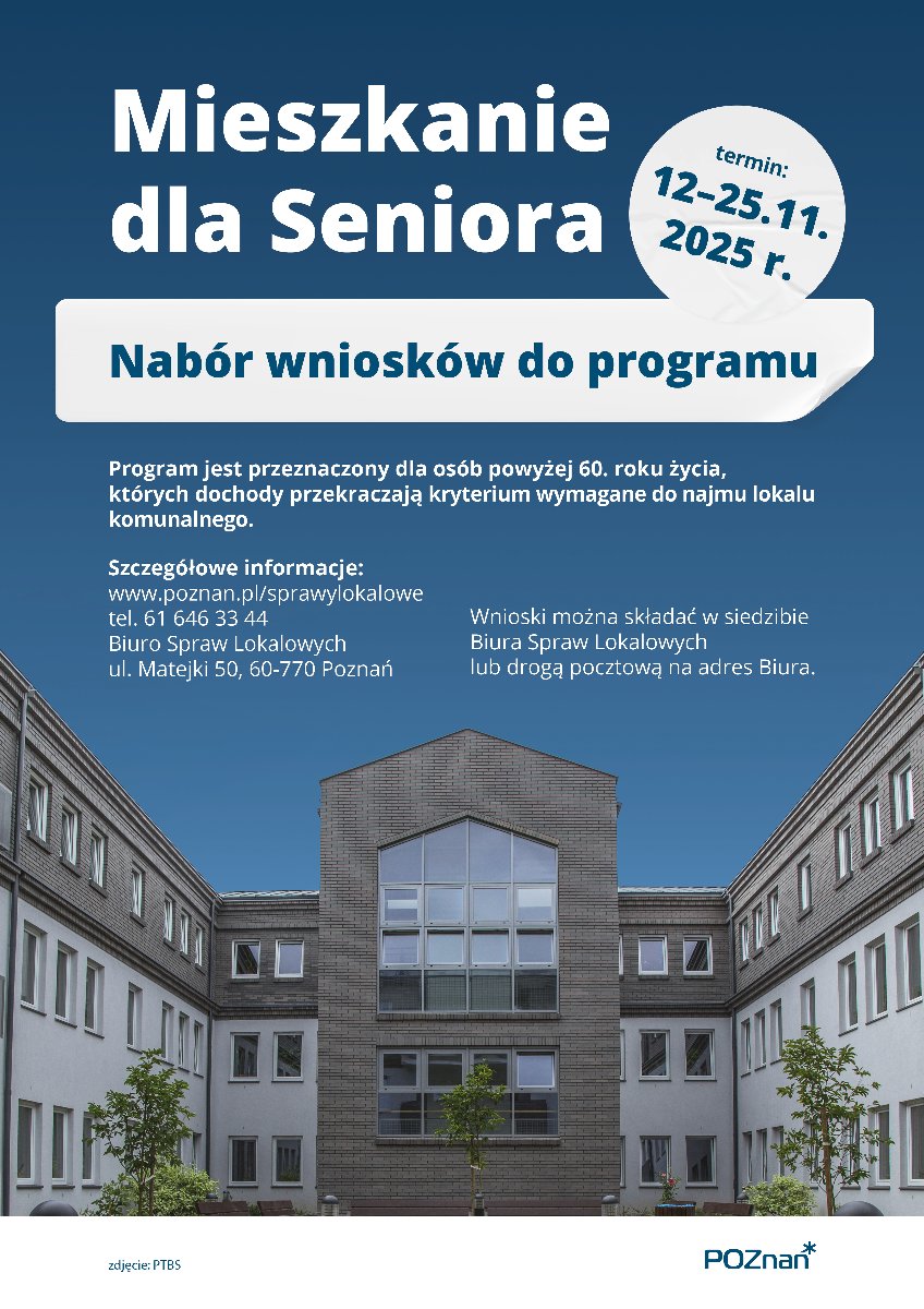 Na zdjęciu widać budynek w kolorystyce szaro-białej. Budynek ma parter i 2 piętra. Przed budynkiem jest teren zieleni, na którym rośnie trawa i drzewka. Budynek jest ogrodzony. Za ogrodzeniem jest droga.